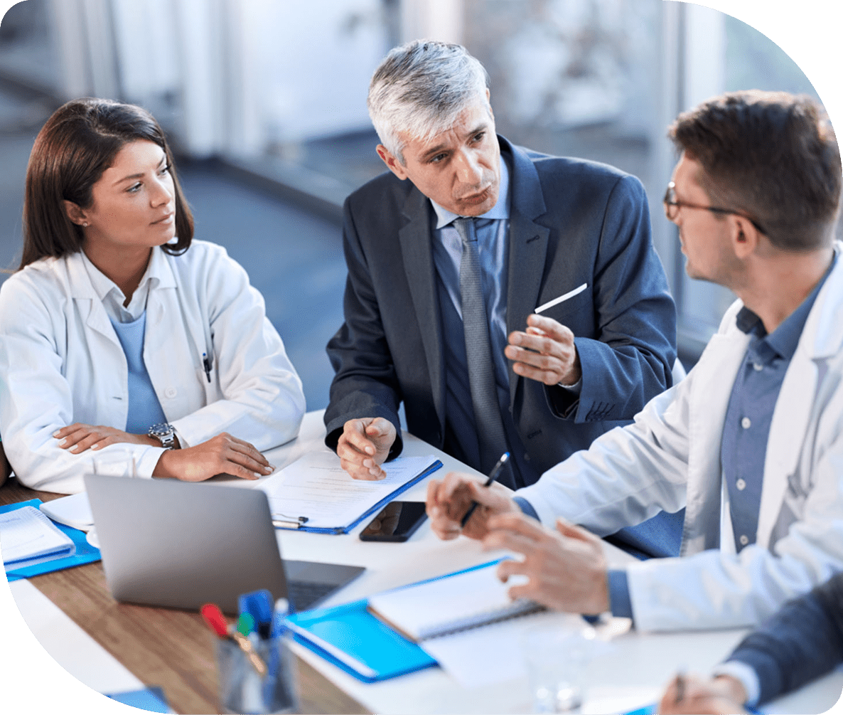 Doctors and businessman in a meeting discussion.